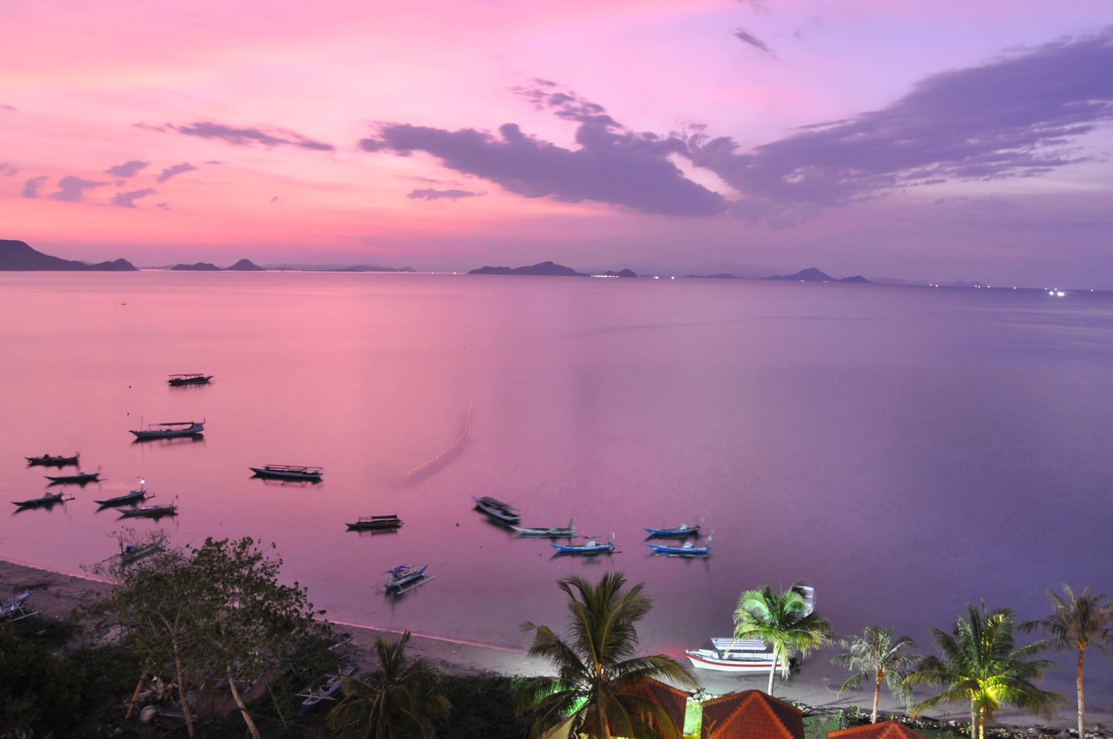 Pink sunset over the bay of Labuan Bajo seen from a hotel