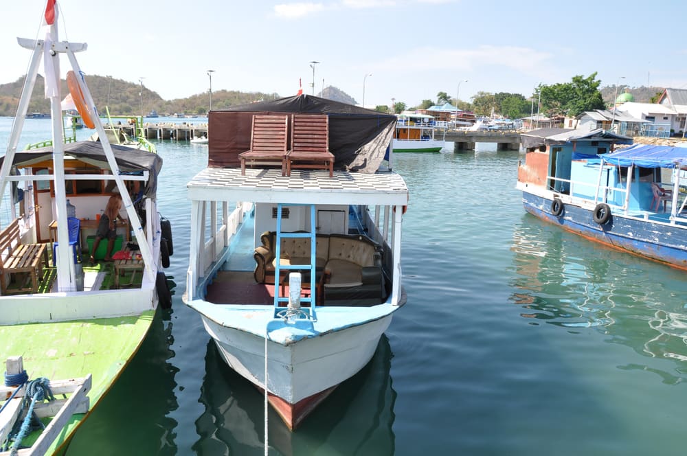 Colourful wooden tour boats moored in Labuan Bajo harbour