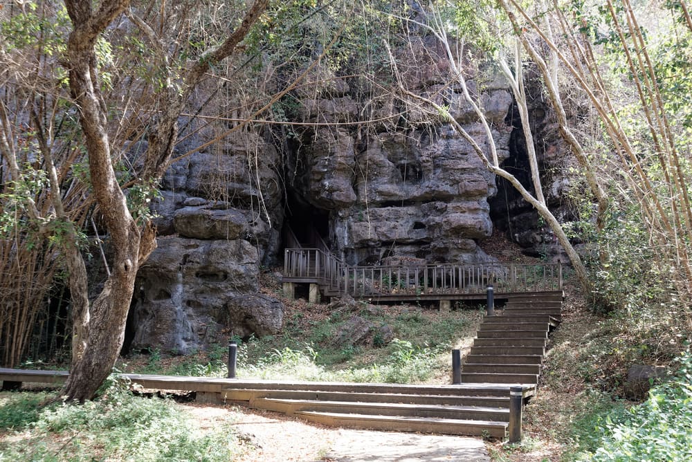 Wooden walkway leading to the limestone Mirror Stone Cave near Labuan Bajo