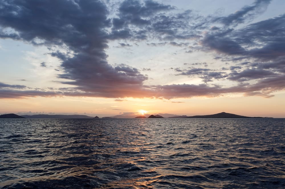 Orange dusk sky over the sea in Komodo National Park